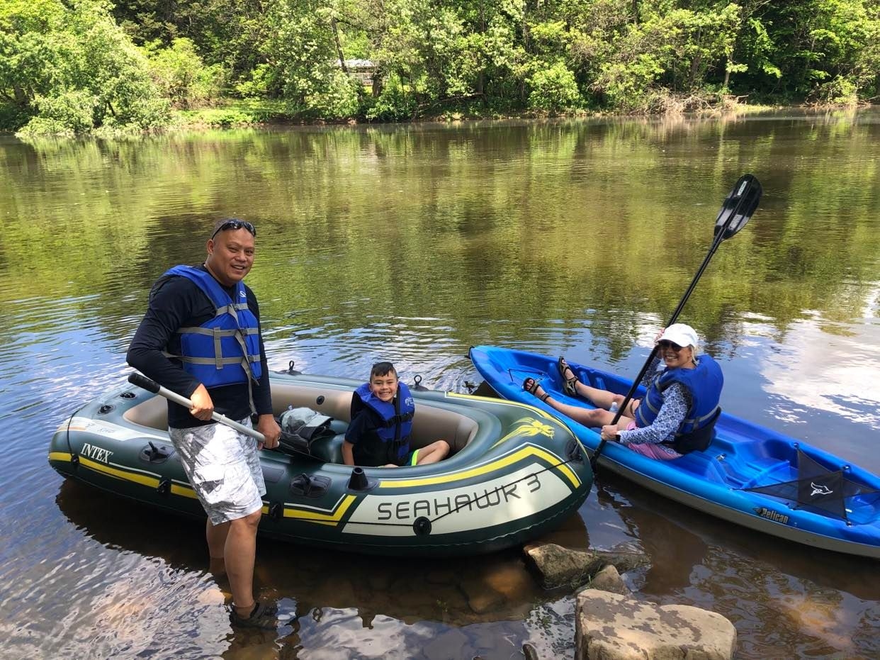 A family in a kayak and a raft