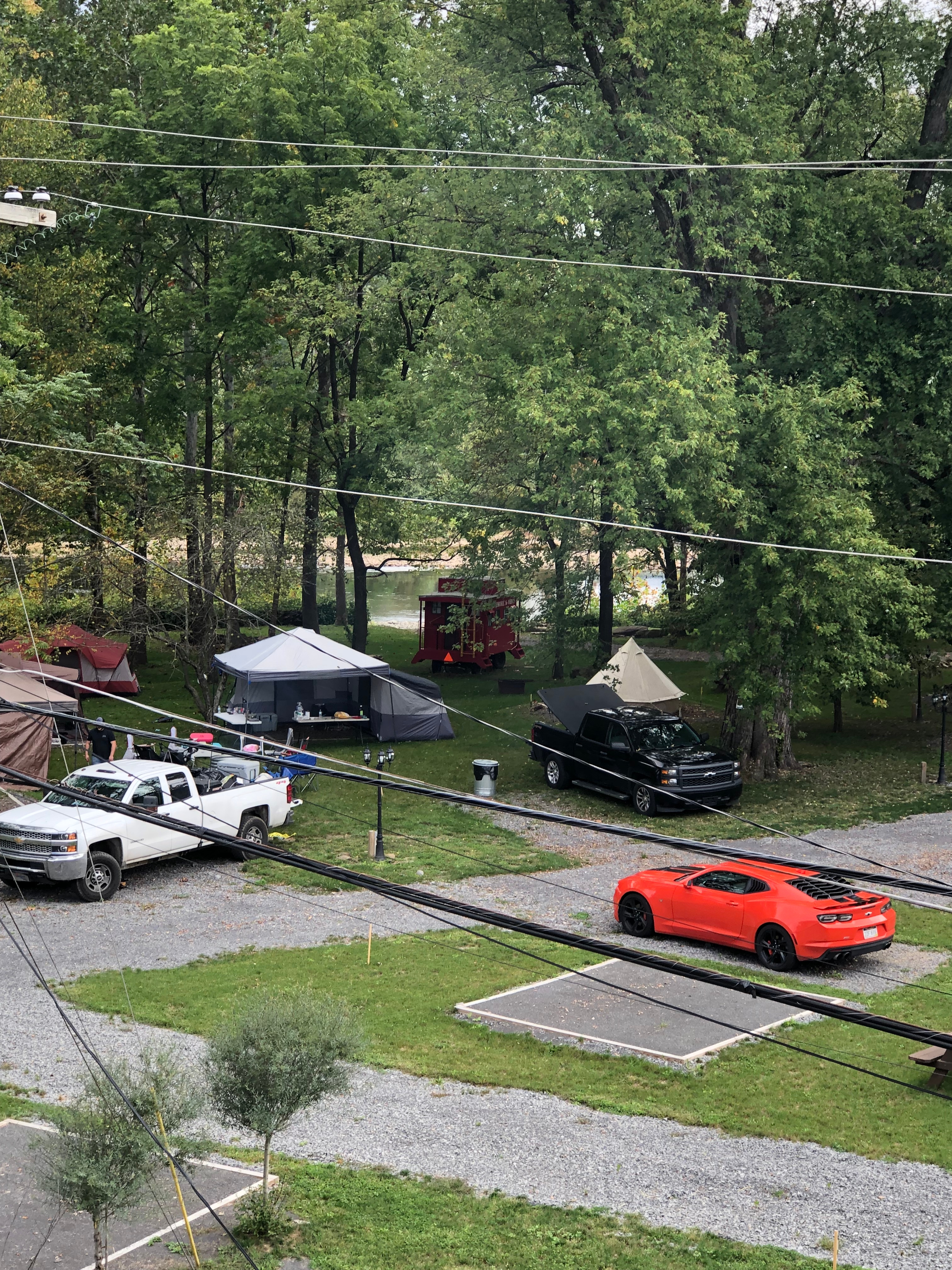 A wide view of the campsite with the river in the background